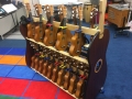 ukuelele storage shelves in a busy music classroom